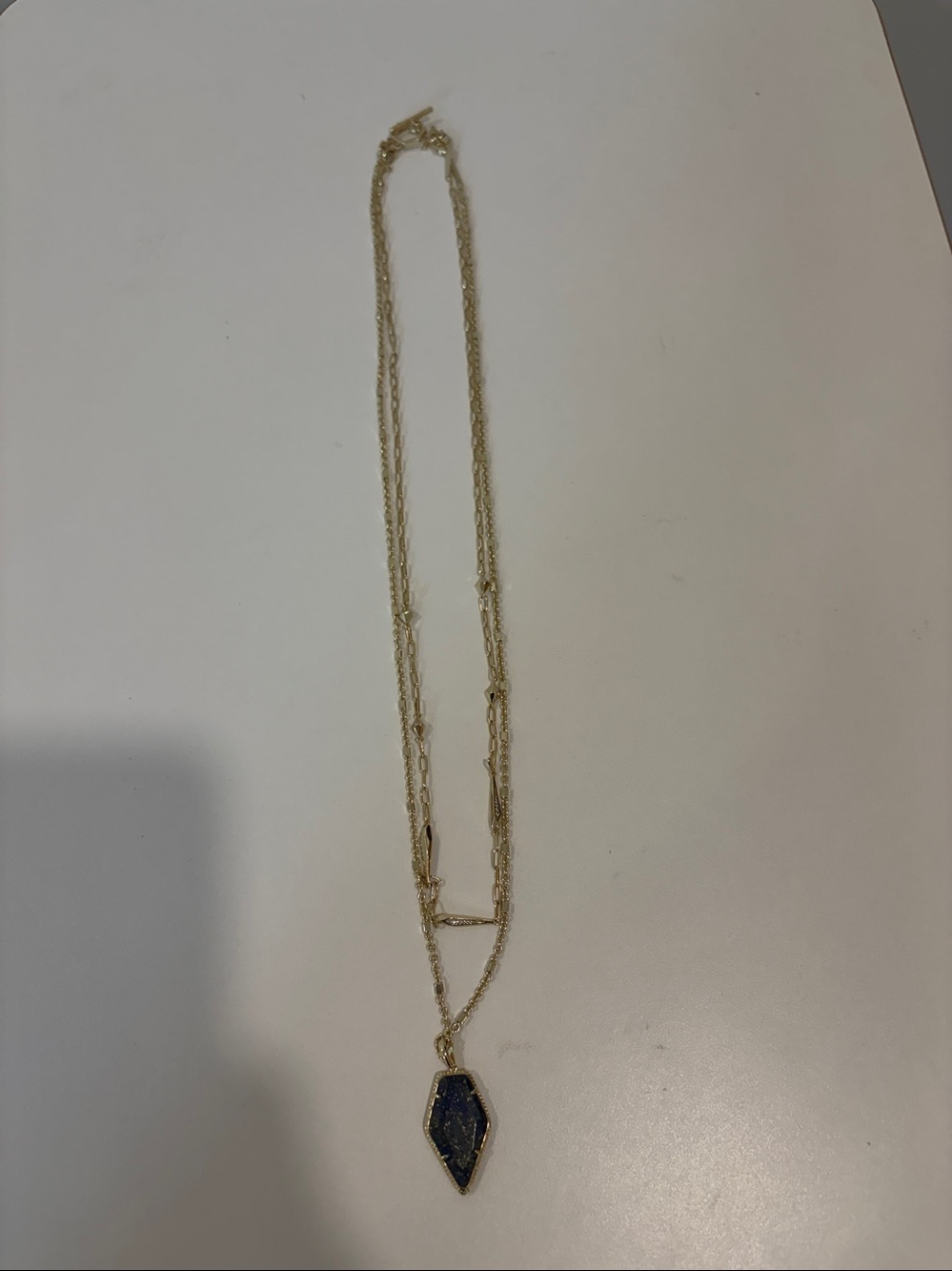 Kendra Scott  Gold Layered Necklace with Blue Stone Pendant - 24” and 22” Chains